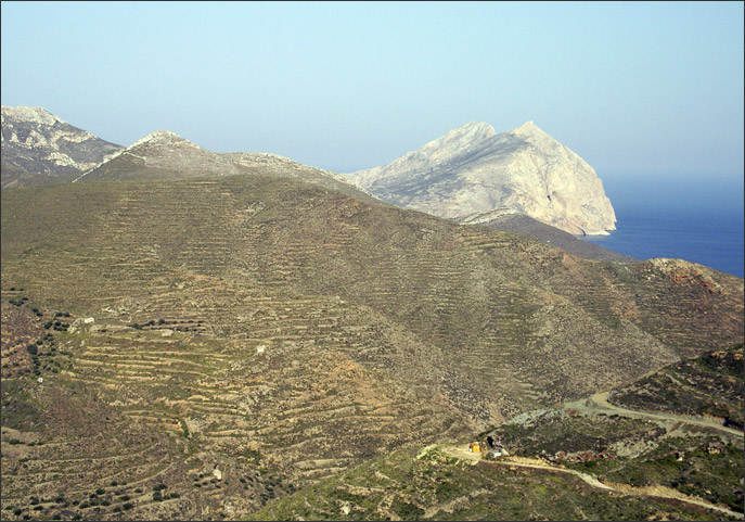 Terraced hills, and the Panaghia Kalamiotissa just visible in the distance